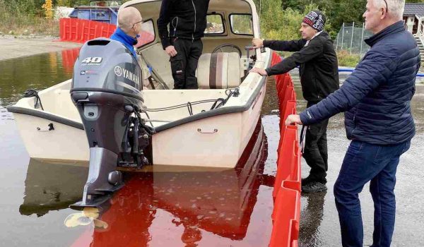men on both sides of the noaq boxwall